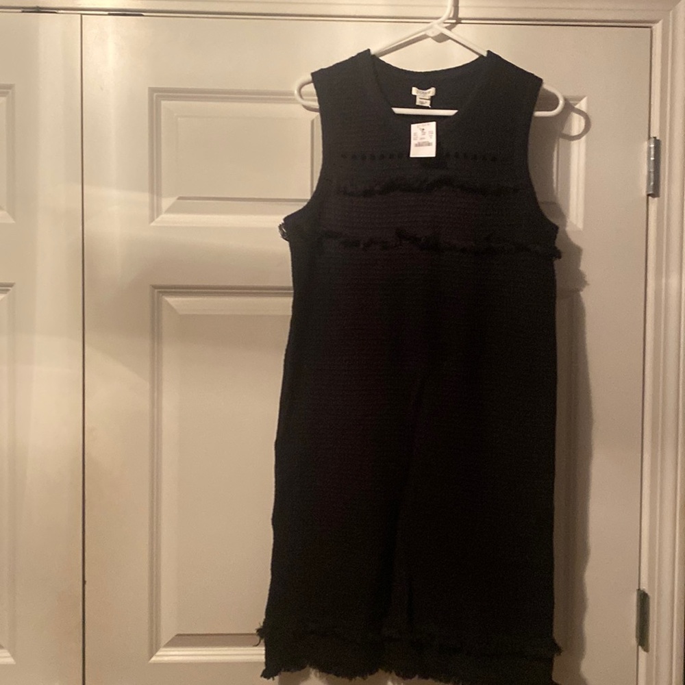 Black sleeveless sweater dress with fringe